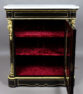 veneered with ebony and mahogany, brass and gilded bronze, marble top