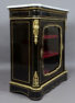 veneered with ebony and mahogany, brass and gilded bronze, marble top