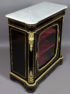 veneered with ebony and mahogany, brass and gilded bronze, marble top