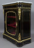 veneered with ebony and mahogany, brass and gilded bronze, marble top