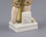 Porcelanowa figurka chłopca z sierpem i snopkiem siana